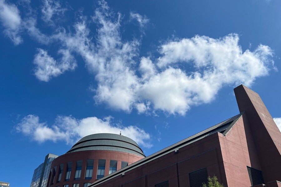 The exterior of Penn’s Huntsman building with a blue sky.