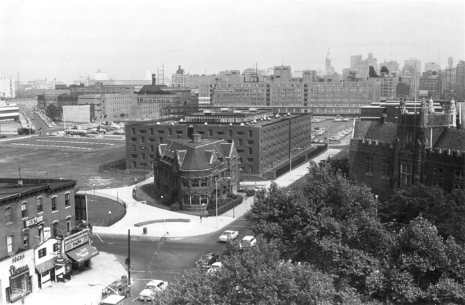 Story Photo Hill College House in 1961. The building was constructed of hand-molded red brick and black steel, and surrounded by a moat and high fence.