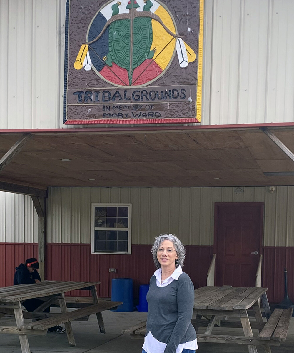 Sherry Caputo in front of the Lenape Tribal Grounds building.