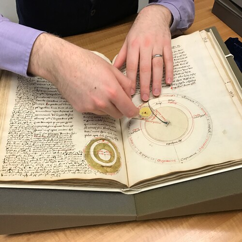 Penn Libraries curator Nicholas Herman with medieval manuscript. 