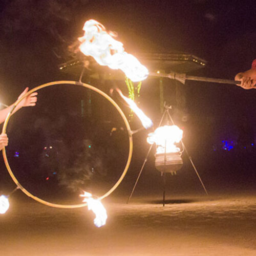Fire dance with a hoop and torch