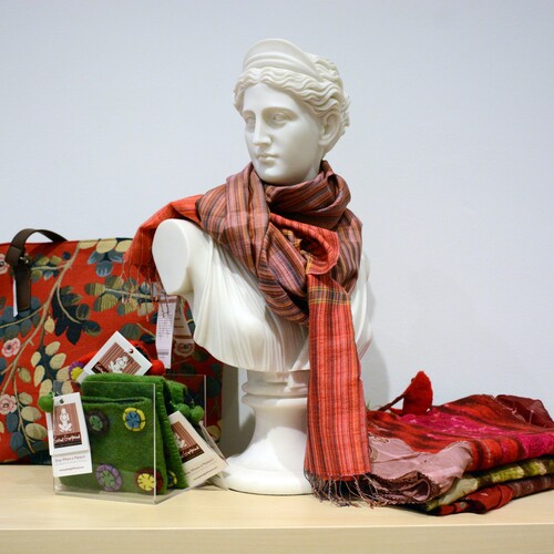 Miscellaneous items from the museum store, like a scarf and tote bag