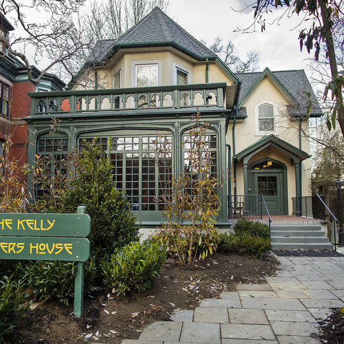 Exterior of the Kelly Writers House with a path to the front door. 