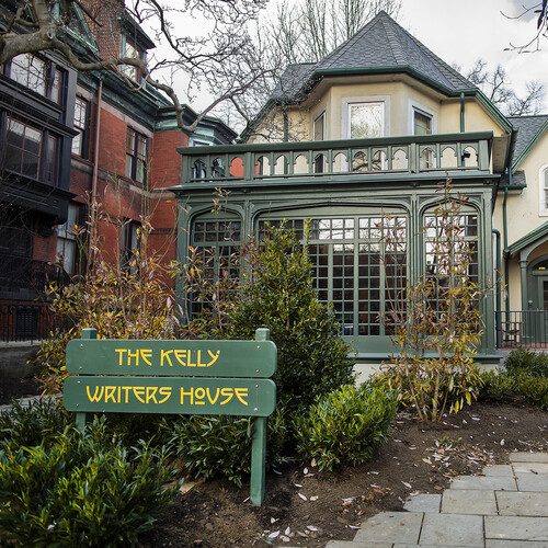 Exterior of the Kelly Writers House with a path to the front door. 