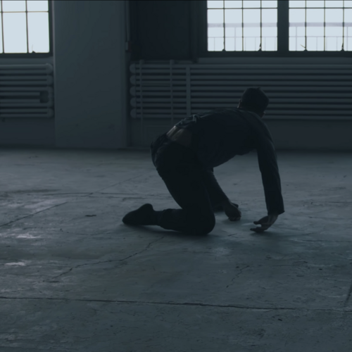 Dancer silhouette in an empty warehouse