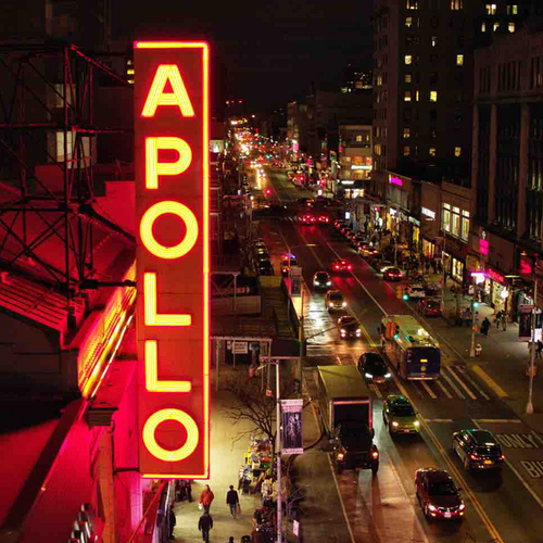 The Apollo sign hangs over bustling New York city street
