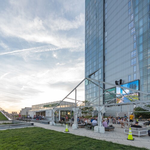 Outdoor patio and lawn with evening sky in background