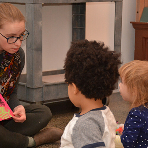 Adult reading to kids