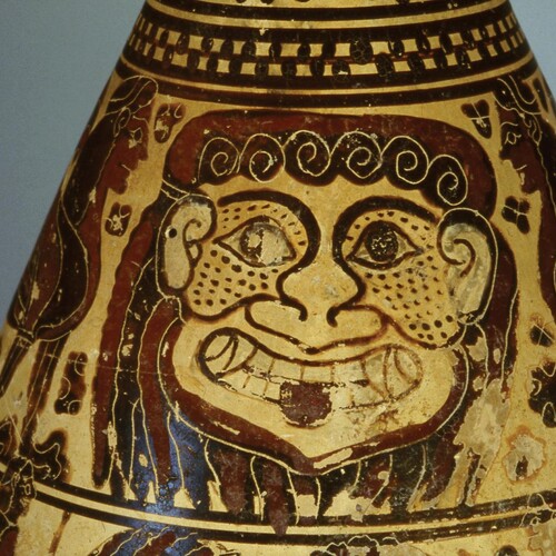 Gorgon sculpted onto ceramic pot