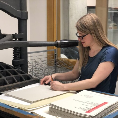 Mary Tasillo prepares proofs at the Common Press