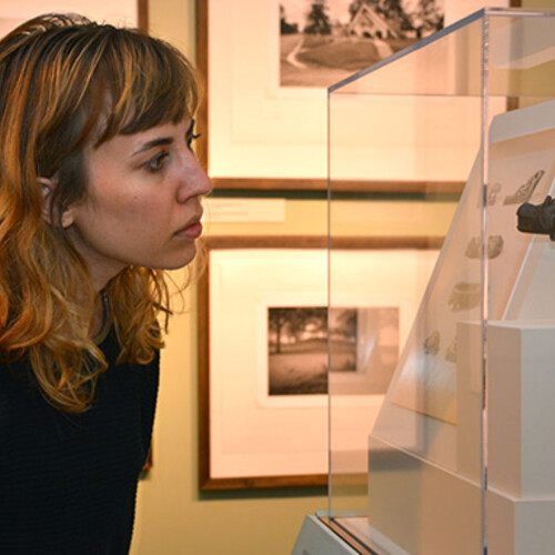 Person staring at artifact in Moundbuilders exhibit space