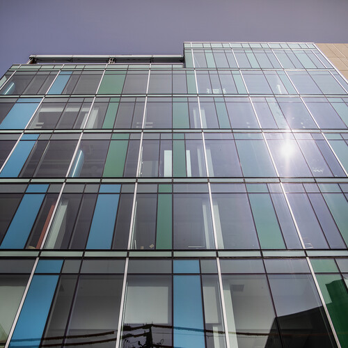 looking up at the facade of tangen hall