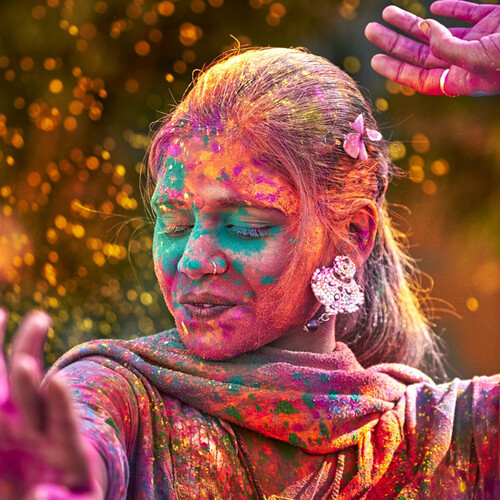 Woman covered in paint splotches