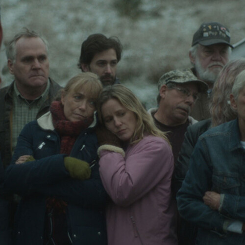 Crowd looking sorrowful
