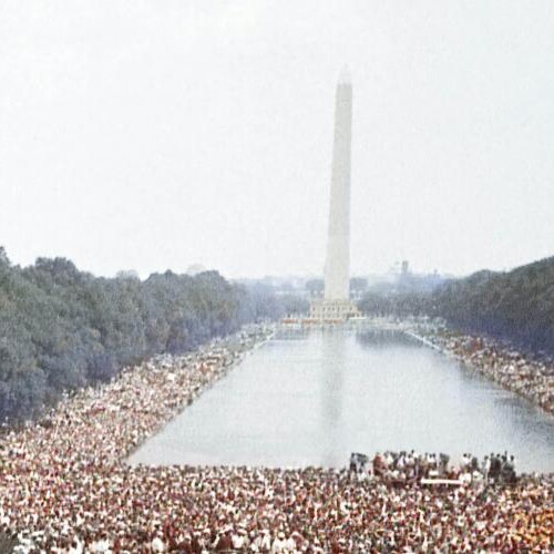 A photo of people gathered at the Washington Monument