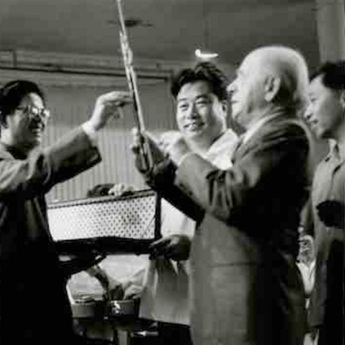 Li Delun with Philadelphia Orchestra conductor Eugene Ormandy, studying scores, exchanging gifts, and rehearsing.