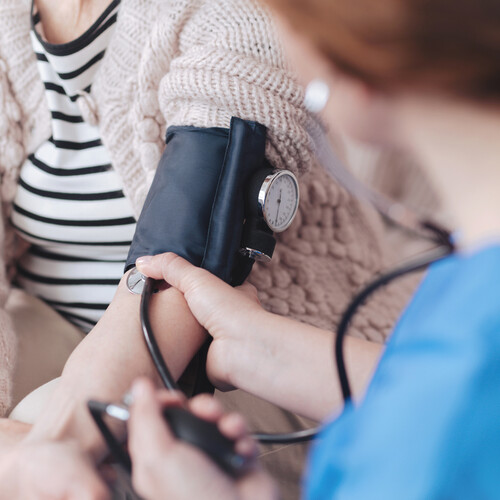 Person getting their blood pressure checked.