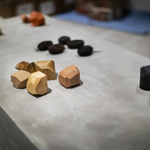 Odd-shaped blocks arranged on a concrete surface