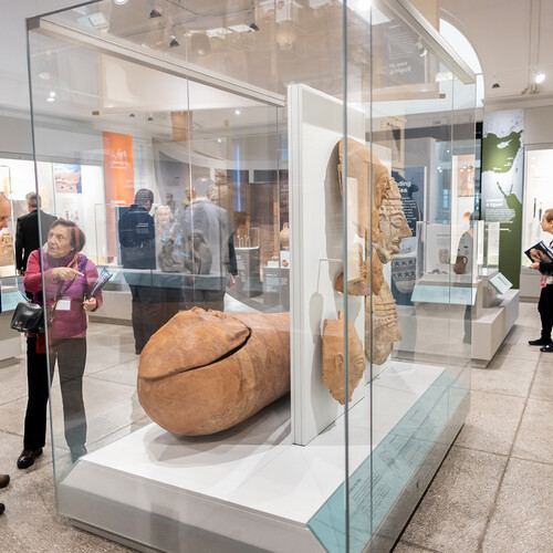 half dozen people in a museum gallery