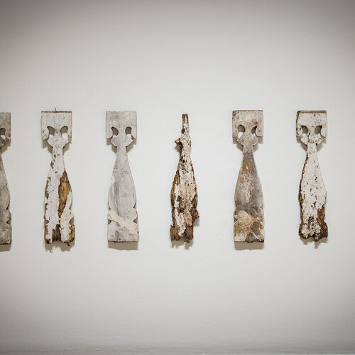 seven wood balusters on the wall