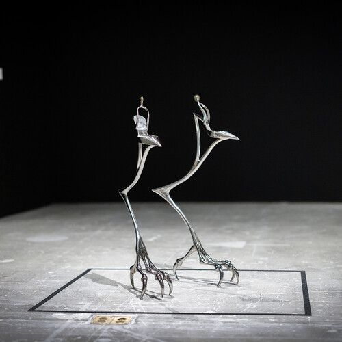 A pair of bird talons represented as a sculpture.