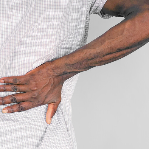 Black man with back pain.