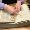 Penn Libraries curator Nicholas Herman with medieval manuscript. 
