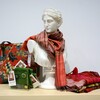 Miscellaneous items from the museum store, like a scarf and tote bag