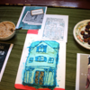 Cake of a house and other food items mixed with pun text Gucci Plantain and The Oatmeal and the Sea