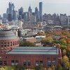 Aerial view of Huntsman Hall and the Philadelphia city skyline in daylight.