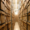a tall aisle of cardboard boxes