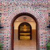 front entrance of Penn Museum with view of sphinx through arched brick doorway