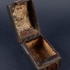 Aged and open coffer box