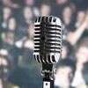 Retro microphone in front of audience.