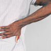 Black man with back pain.