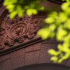 Close up of Fine Arts building, with green tree in front