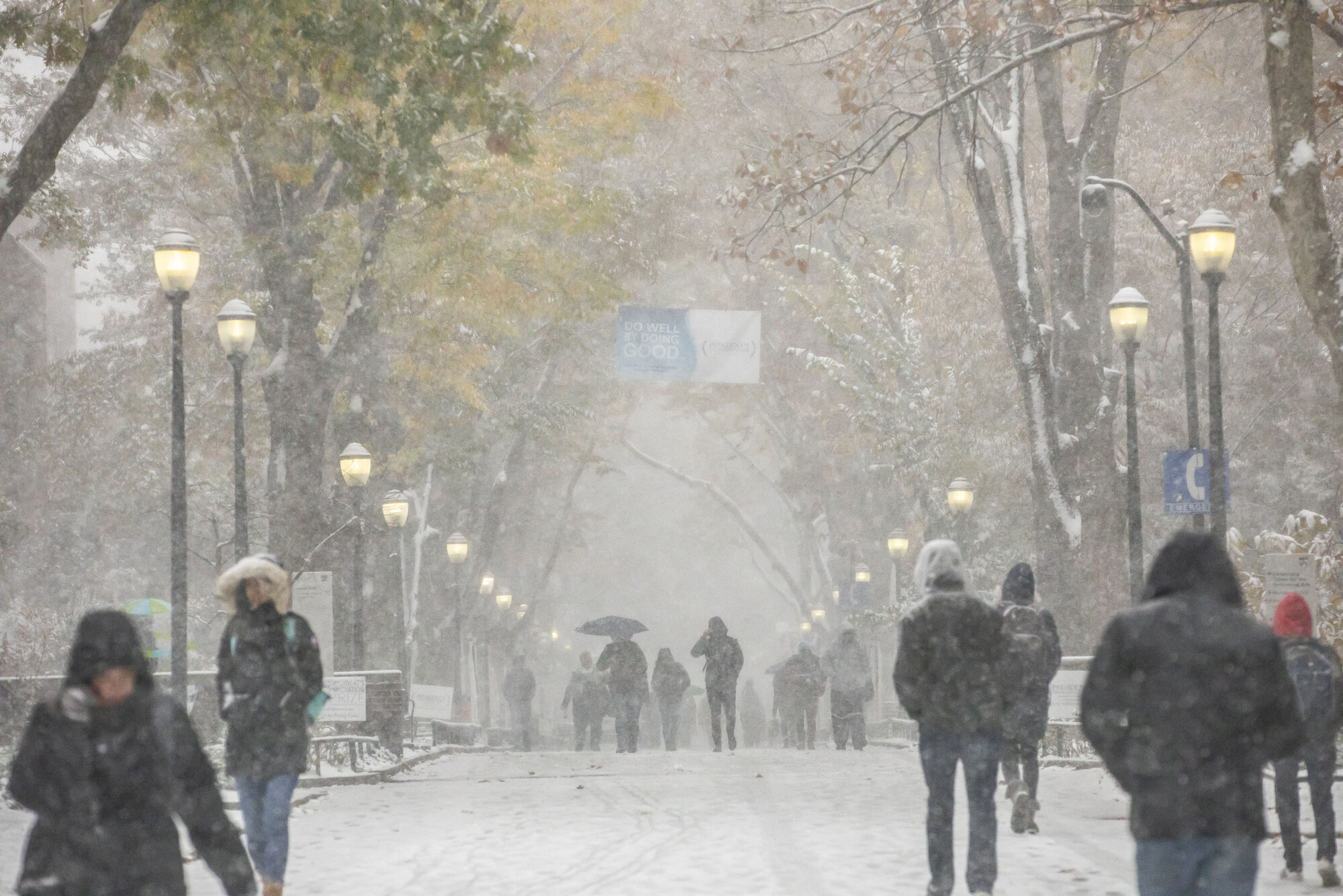 Students in the storm along Locust Walk 