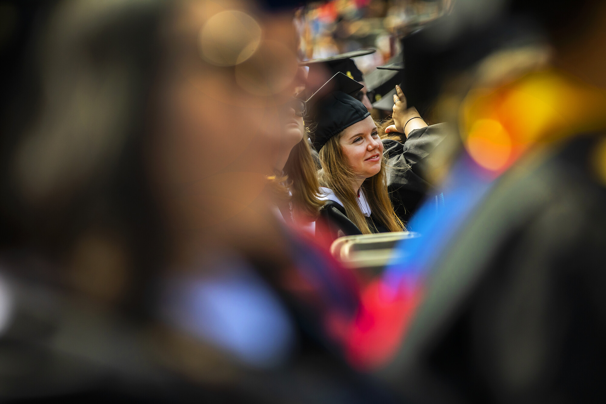 A graduate seated in the audience.