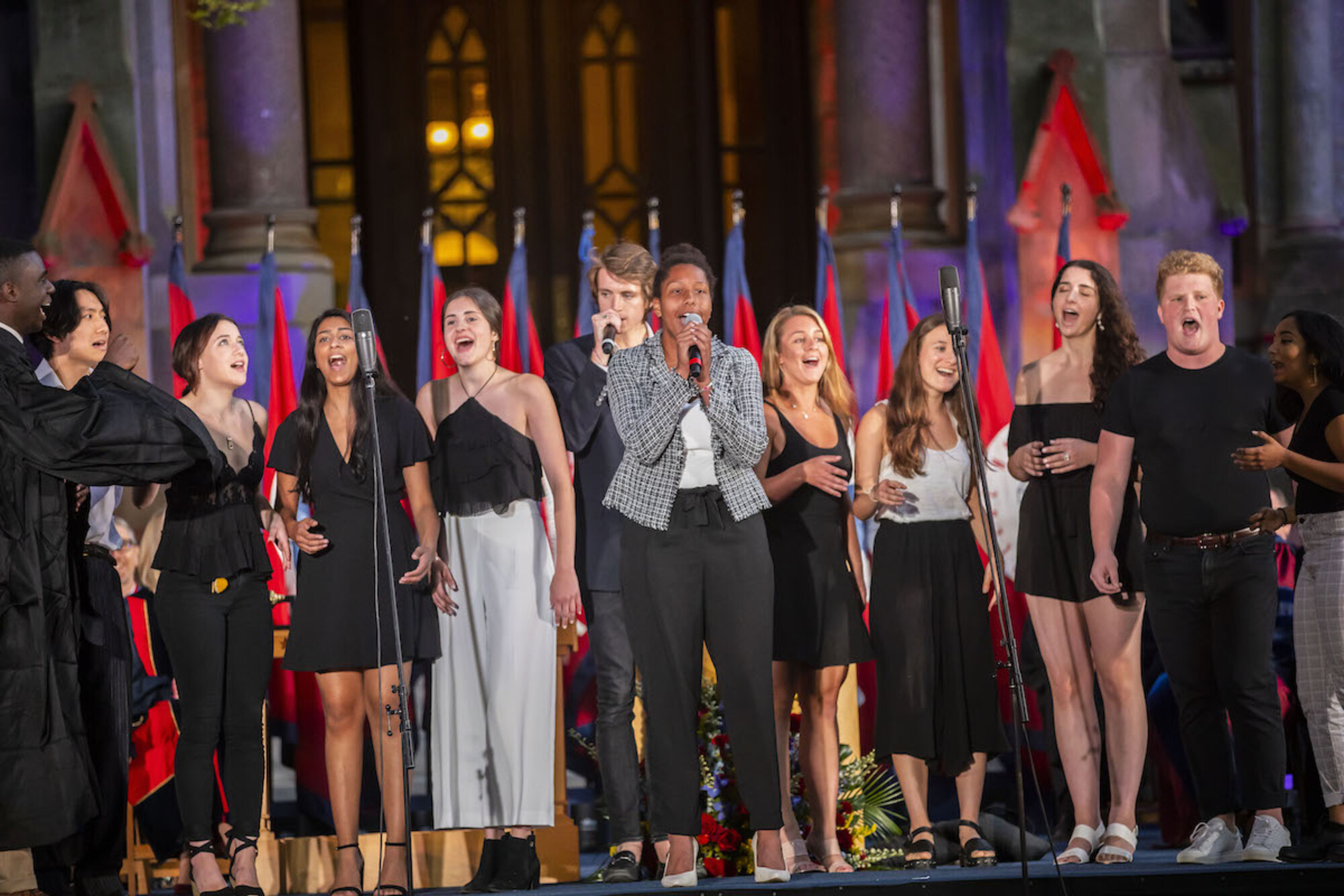 student groups singing on stage at convocation 2019