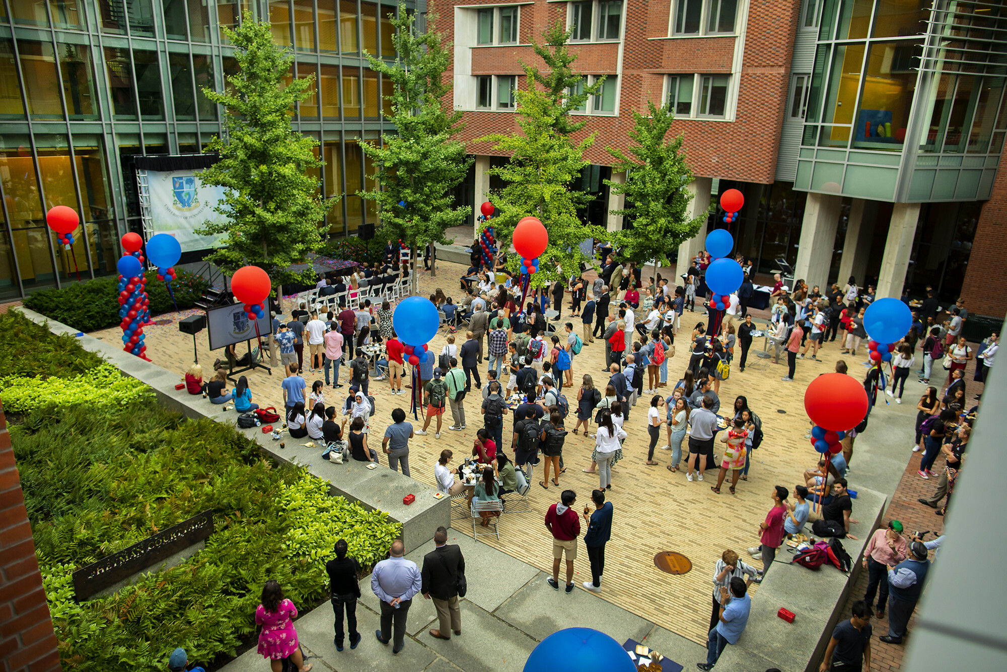 aerial view of Lauder College House courtyard with attendees and balloons