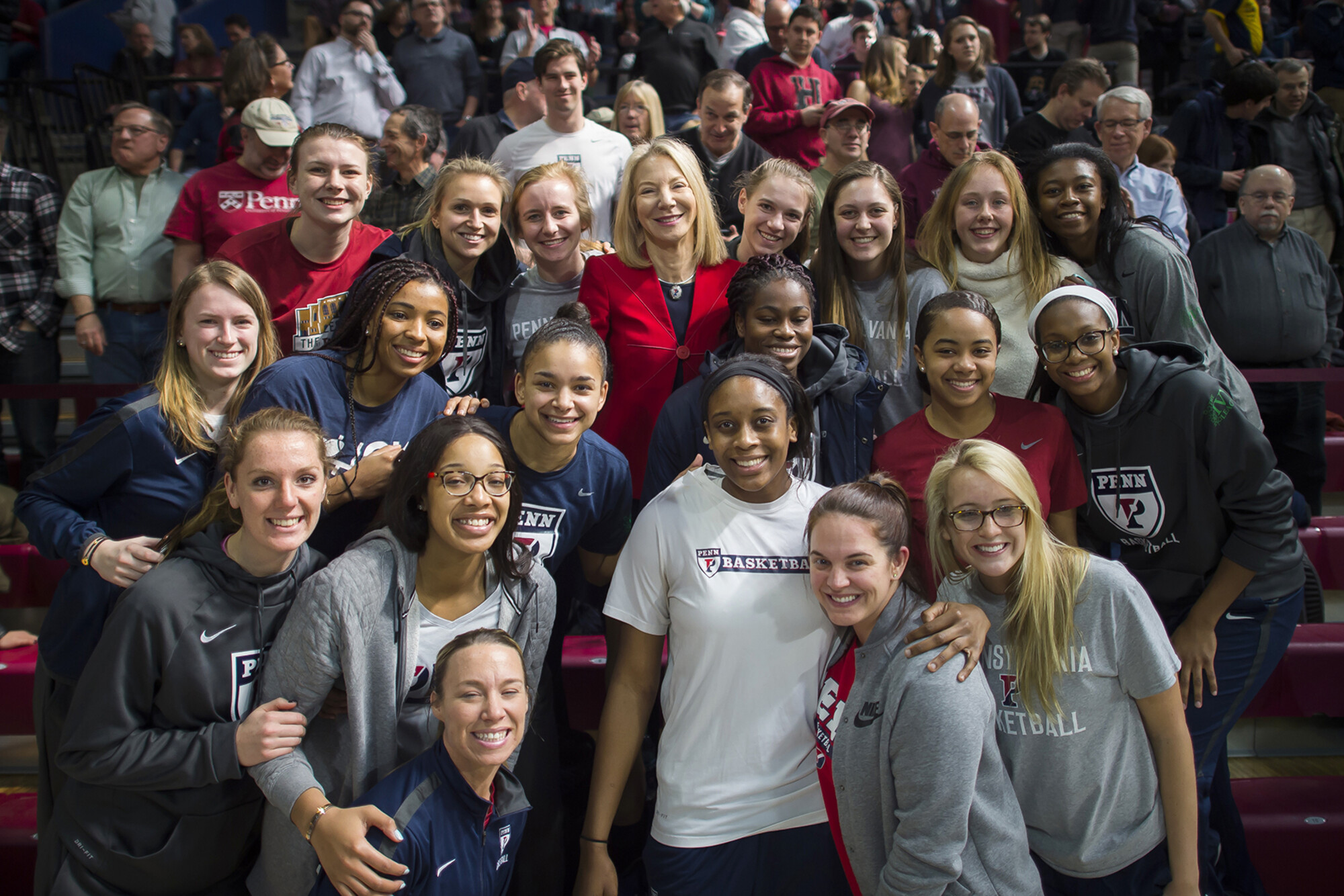 penn president amy gutmann with students at the palestra