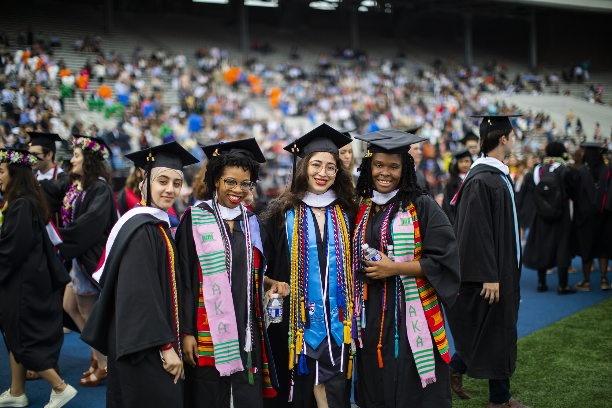 graduates posing for a photo during commencement