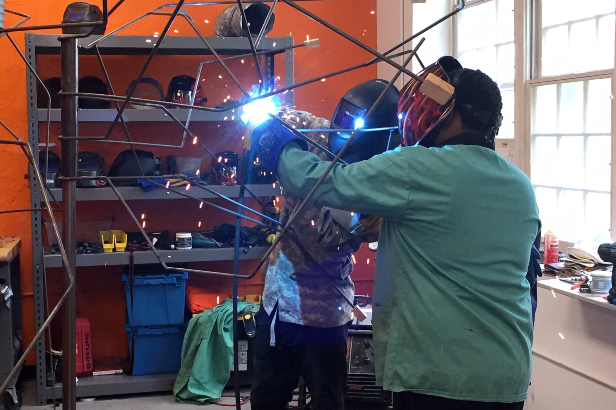 teaching welding to high school students as part of design to thrive