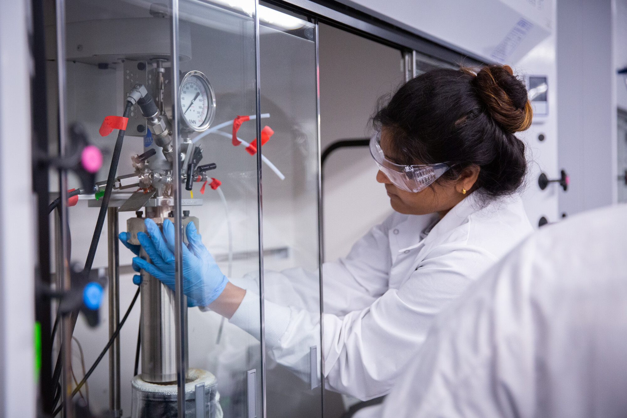 lab member opening fume hood