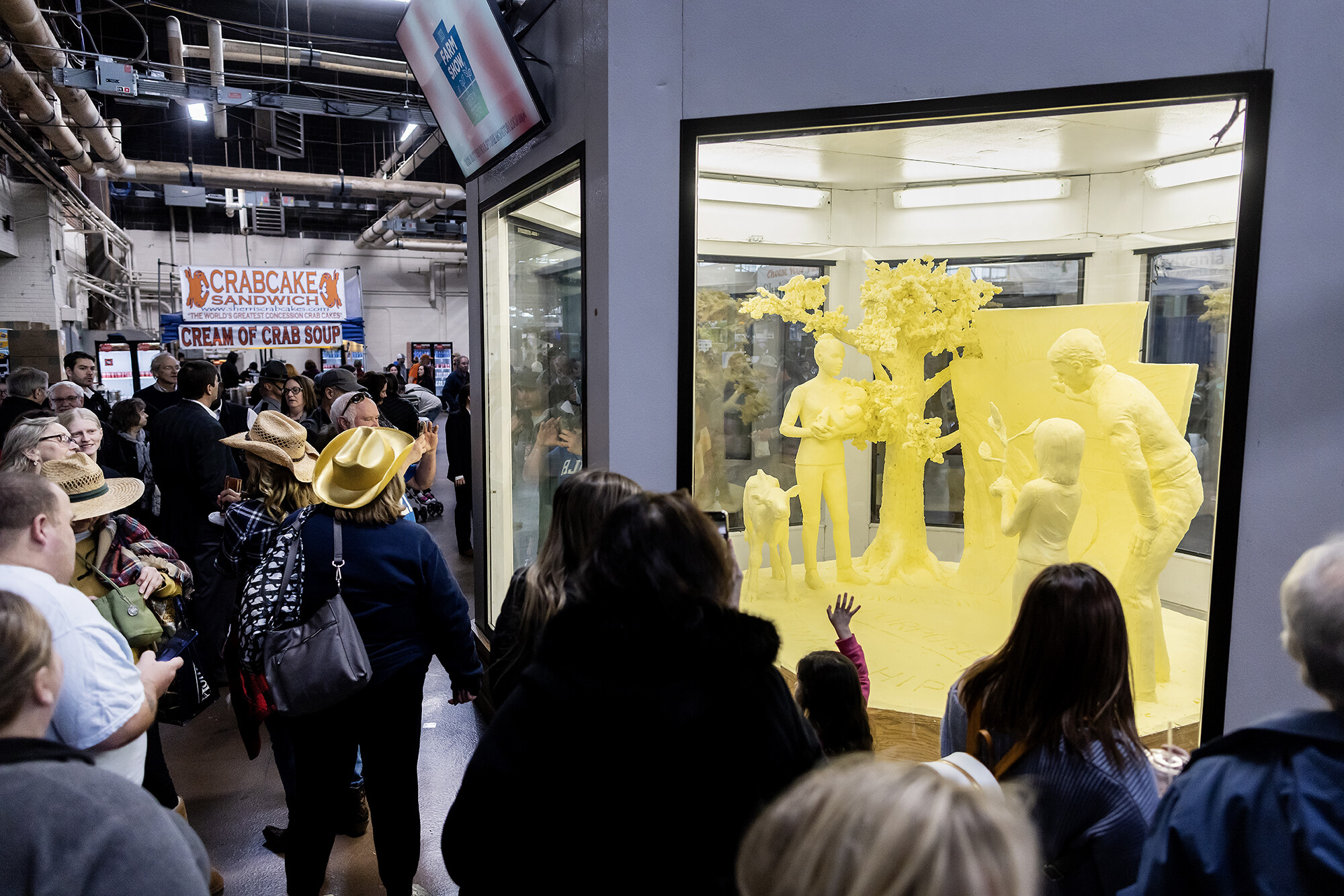 farm show attendees viewing the butter sculpture
