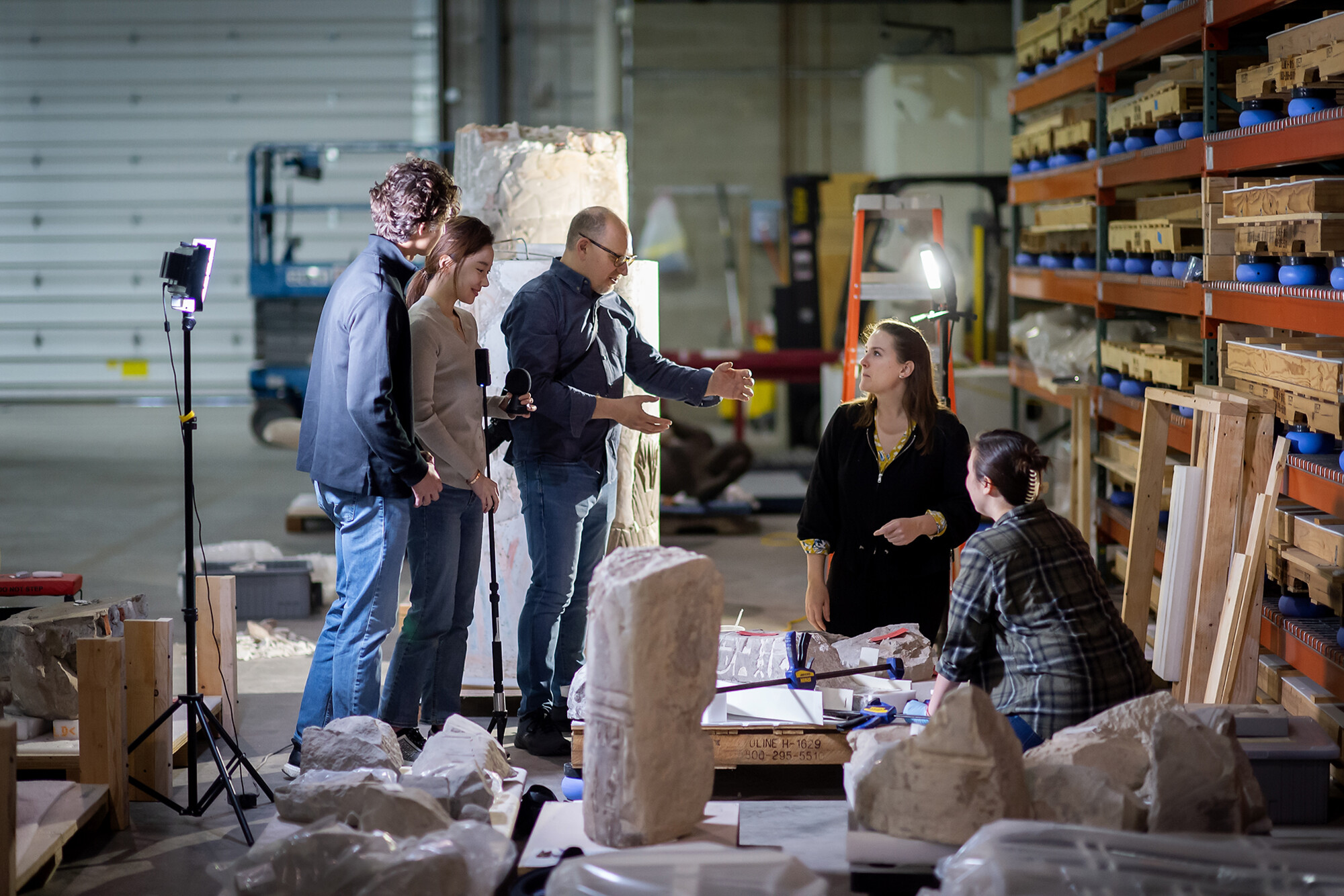 Peter Decherney and three students in the Penn Museum warehouse.