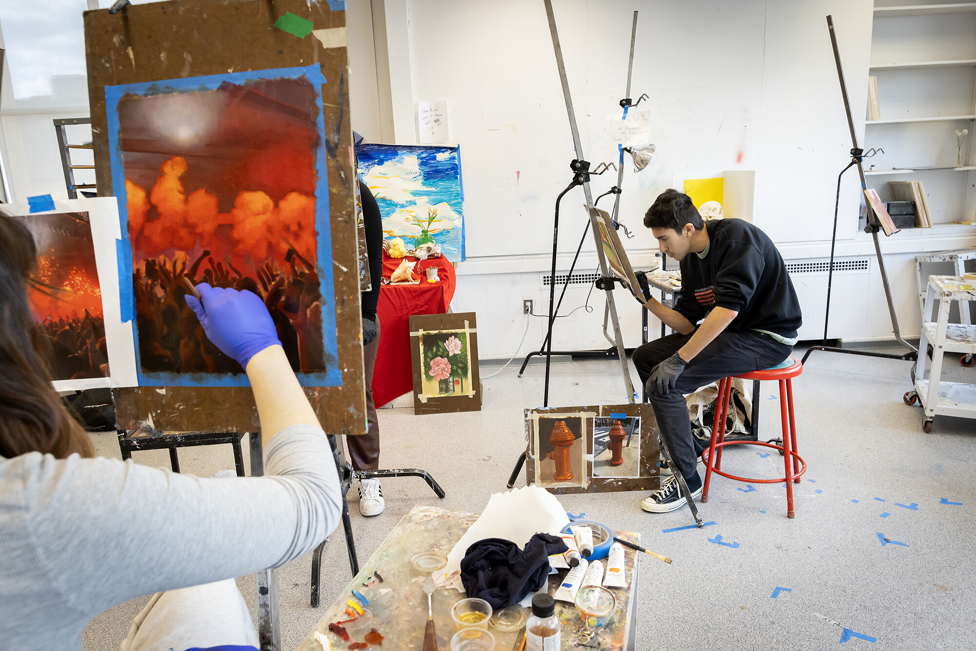 students painting on easels 