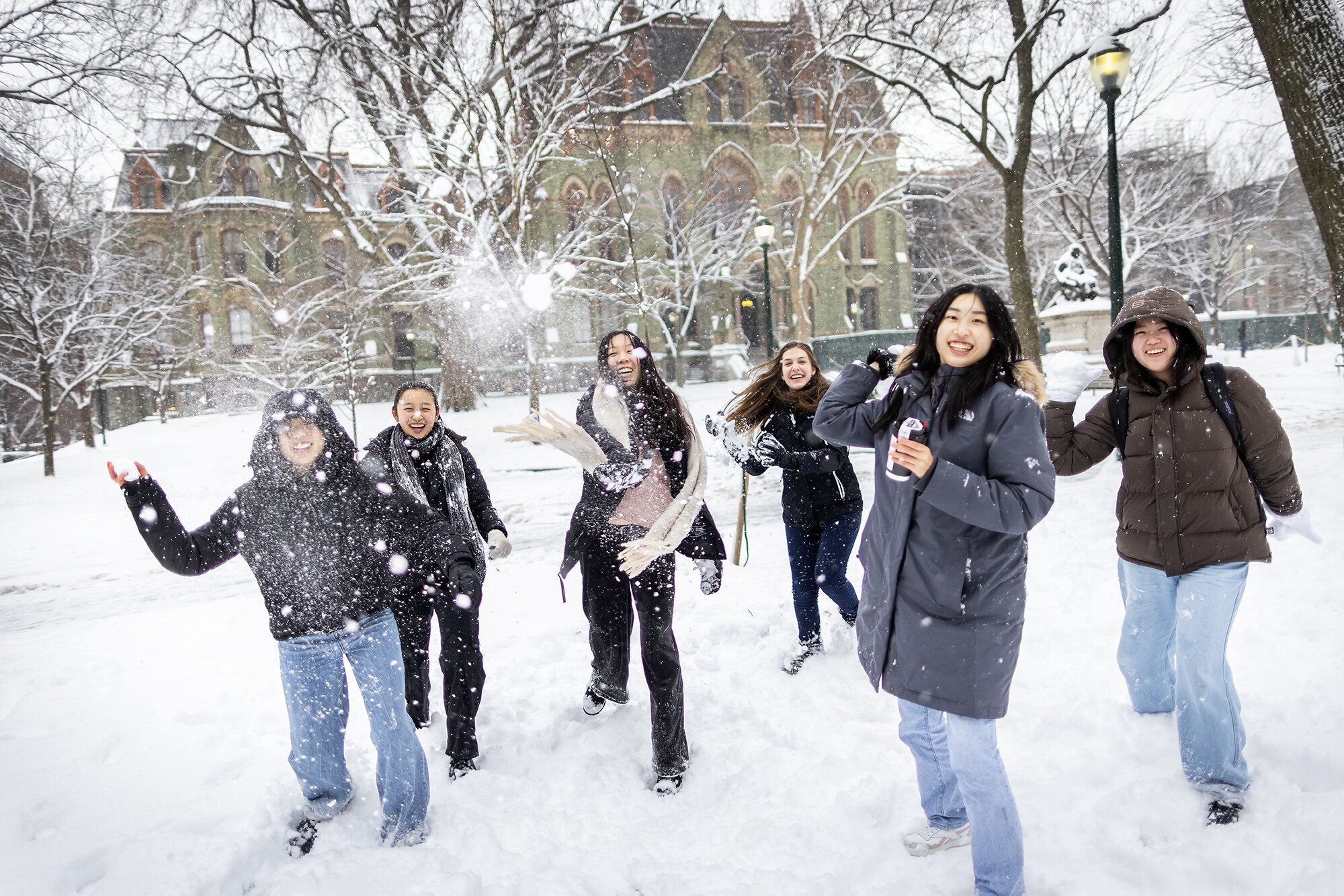 snowball fight on campus during a snow day