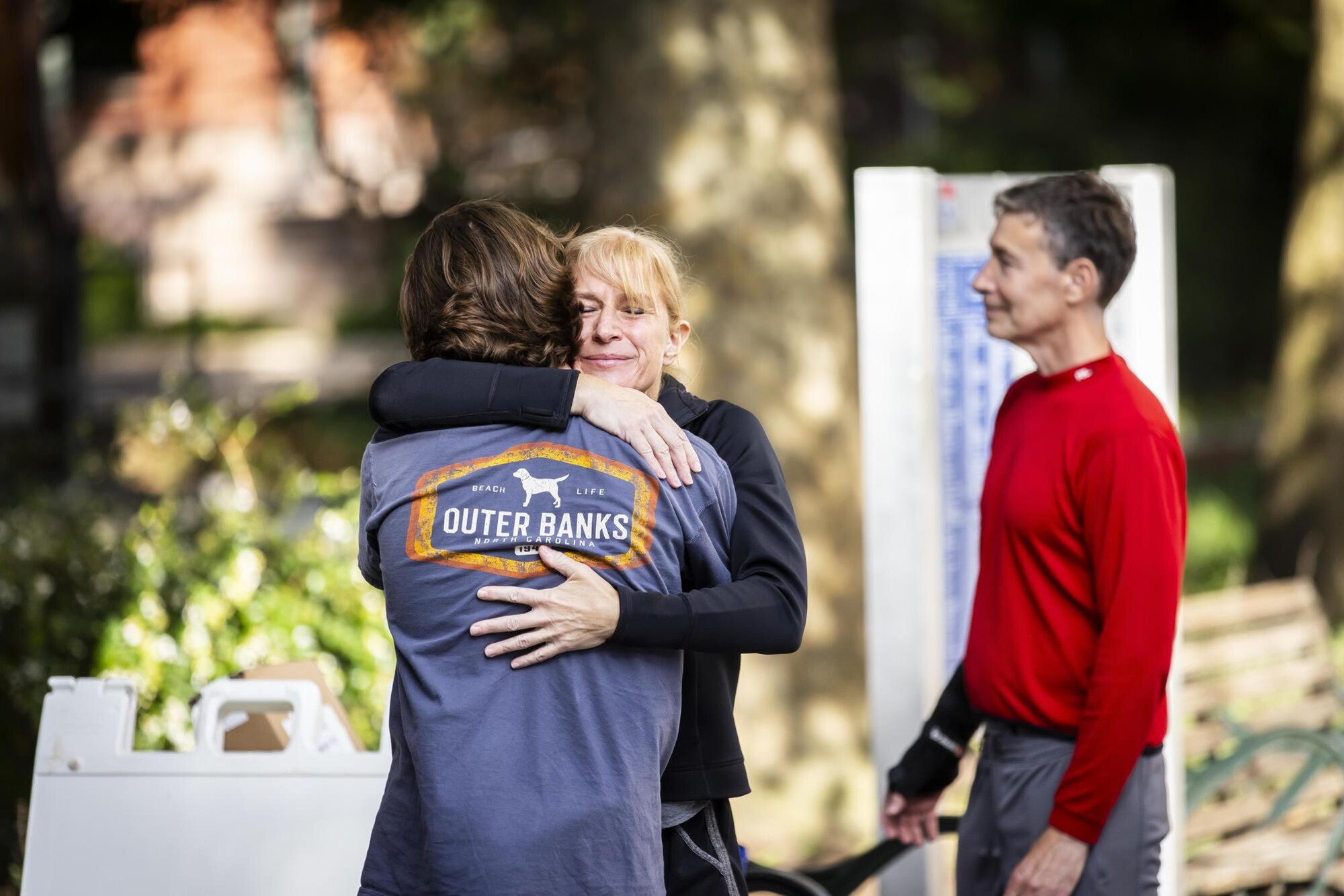 A parent hugs their Penn student child on Move-In day.