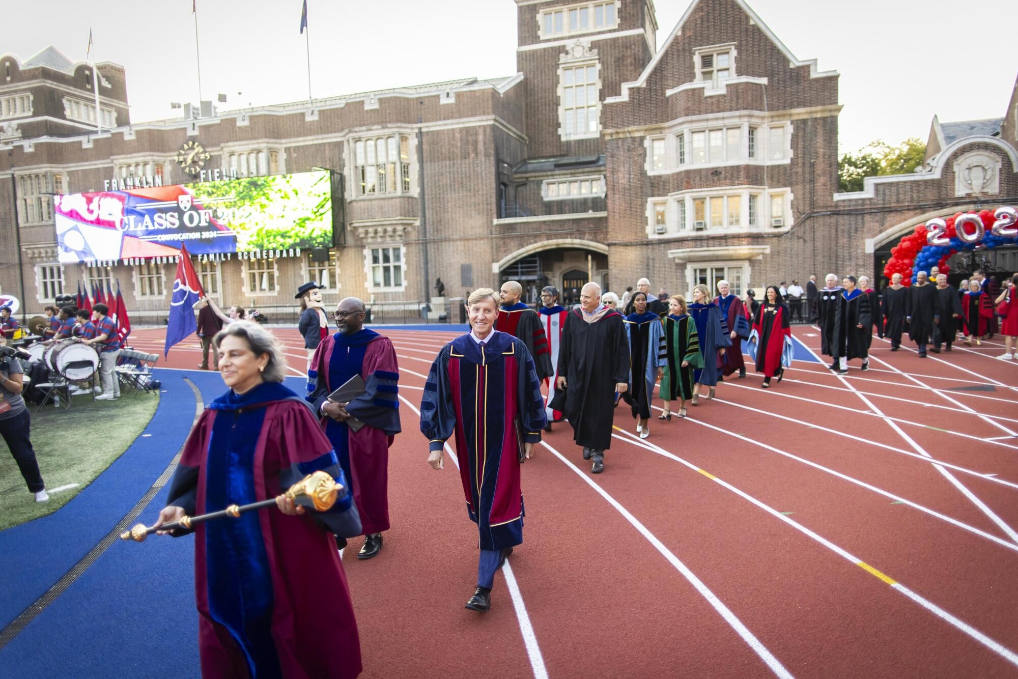 A procession of Penn faculty in regalia arrive on Franklin Field for Penn’s Convocation for the Class of 2028.